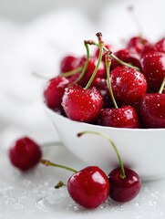 Fresh wet red cherries in white bowl