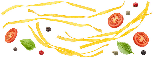 Fettuccine pasta with basil leaves and tomato slices isolated on white background
