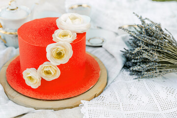 Elegant red dessert decorated with white roses