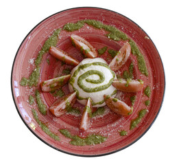 Burrata caprese salad with sliced tomatoes and pesto