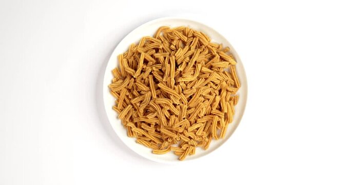 Crispy soya stick snack served in a bowl, healthy high-protein Indian namkeen for tea time or evening munching