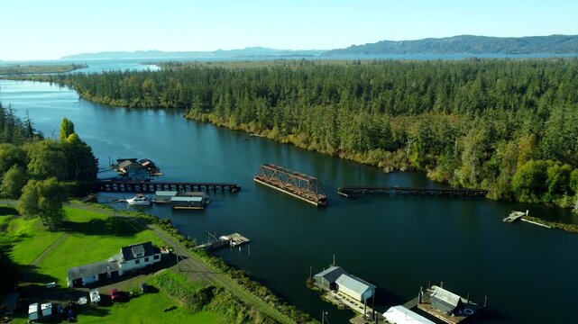 US, OR, Knappa, 2025-10-21 - Drone view of an abandoned railroad trestle on a tributary of the Columbia River.