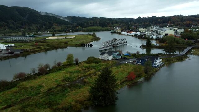 US, WA, Raymond, 2025-10-25 - Drone view of the abandoned train trestle rotating bridge on the Willapa River