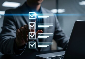 Businessman ticking digital checklist on virtual screen while working on laptop, representing task management, project planning, productivity, and business technology concept.
