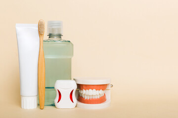 Mouthwash and other oral hygiene products on colored table top view with copy space. Flat lay. Dental hygiene. Oral care kit. Dentist concept