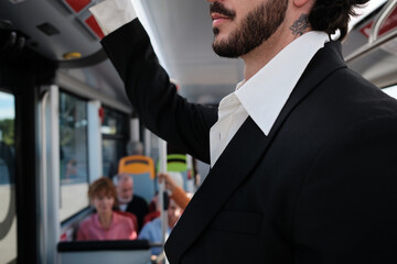 Man commuting to work on public bus