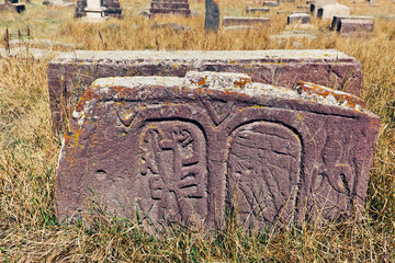 Medieval Armenian "Khachkar" - carved memorial headstone bearing cross, life scenes or decorative interlaces and botanical motifs. Noratus, Gegharkunik Province, Armenia