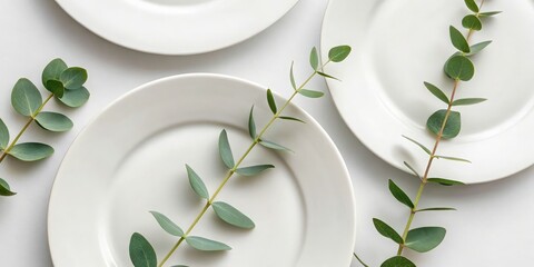 Thanksgiving Decoration Elegant plates adorned with green leaves create a minimalist aesthetic.