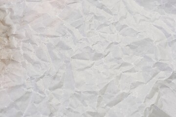 High resolution wrinkled white paper texture perfect for backgrounds, design projects, and creative layout elements.