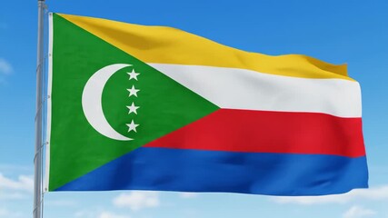 Comoros flag waving in the wind on a bright day under a blue sky, showcases national pride and