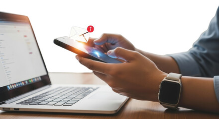 Person using smartphone with email notification near open laptop on transparent background
