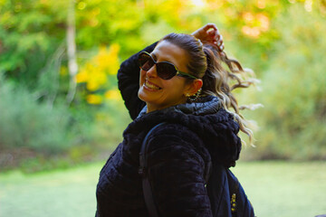portrait of young beautiful woman near the lake in Autumn