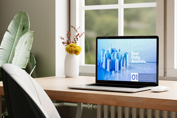 3D city data interface on screen, laptop workspace