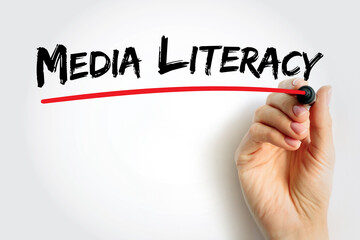 Media Literacy text hand drawn with red underline by marker, concept for understanding news, digital media education, and information analysis skills