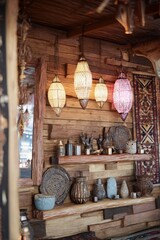 Rustic wooden wall with decorative lanterns and artifacts creating warm ambiance