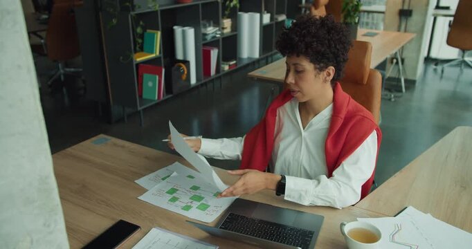 Dedicated product manager analyzing prototypes and coordinating team tasks