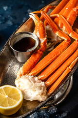 Close-up crab legs with lemon in restaurant