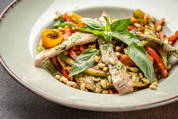 Warm veal salad with vegetables and basil