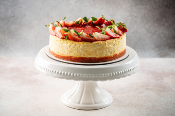 Strawberry cheesecake on elegant cake stand