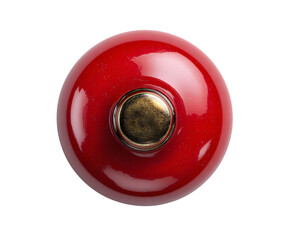 Shiny red circular knob with vintage brass detail, a top-down isolated view isolated on white background