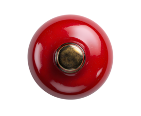 Shiny red circular knob with vintage brass detail, a top-down isolated view isolated on white background