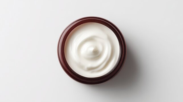 Luxurious Cream: An overhead view captures a swirl of thick, creamy product in a minimalist, aesthetically pleasing arrangement.