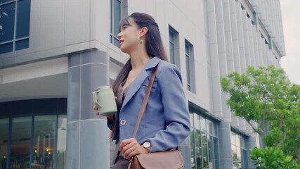 Young business businesswoman walking outdoor through modern office district, holding mobile phone and coffee cup, managing daily tasks during travel on busy city street. - Powered by Adobe