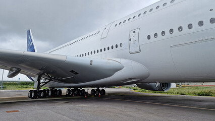 double-decker commercial aircraft with large cargo capacity for passengers and tourists on the airport tarmac