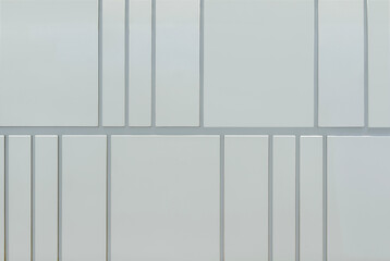 Close up of white grey panel with linear grouts. Suitable for modern contemporary wall accent design. Seamless background texture.