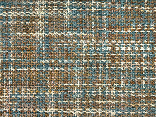 Close up of micro linen wallpaper or fabric in mix of blue, brown, grey and white thread color. Graphic background for sofa and upholstery. Seamless background texture.