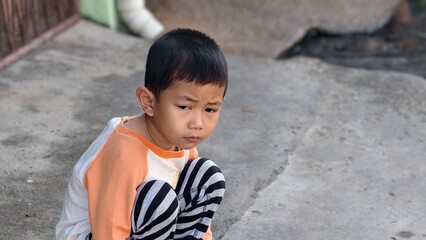 portrait of a little boy, Sitting bored