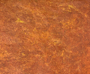 Decorative orange copper washed paint on a surface. Random limestone orange copper washed paint with grunge, and dirt pattern. Seamless background texture.      