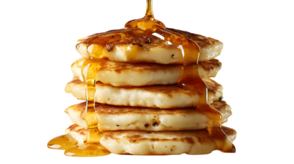 Stack of pancakes with syrup being poured on top against a dark background in a studio setting