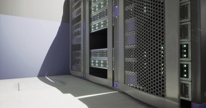Advanced server racks are arranged neatly in a technology data center. The equipment is powered on, showcasing multiple active components. Ambient lighting enhances the tech atmosphere.