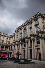 Majestic architecture of a historic building under a cloudy sky.