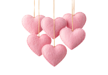 Pink felt hearts hanging on strings, isolated on a transparent background