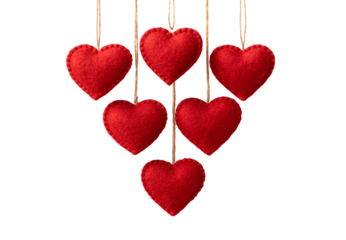 Six handmade red felt heart ornaments hanging on rustic twine, isolated on a transparent background