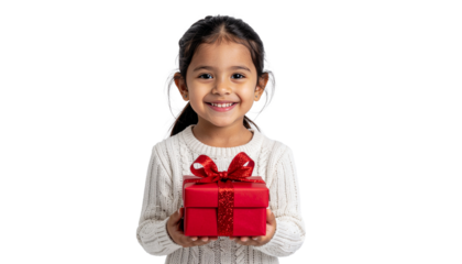 A joyful young girl beams, holding a beautifully wrapped red Christmas gift, ready to share holiday cheer against a pristine white studio background.
