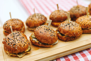Mini Sesame Burgers on Wooden Serving Board
