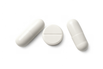 White capsules and a tablet representing medication, pharmacy, and medical drug concepts. Transparent background
