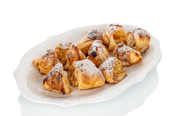 Fragrant mini strudels with apples on a white background, close-up.