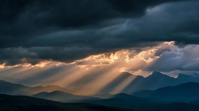 Rays of sunlight piercing through dark storm clouds over a mountain range