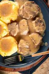 Braised pork tongues in mustard-horseradish sauce.