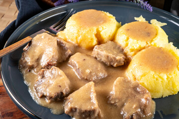Braised pork tongues in mustard-horseradish sauce.