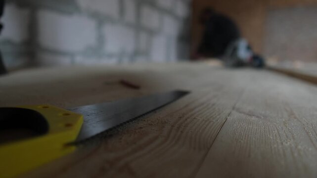 Preparing wooden planks for installation. Tools and workspace during real construction