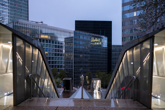 Corporate architecture framing reflection and modern skyscraper lines over urban la defense in paris france symbolizing growth in the financial district