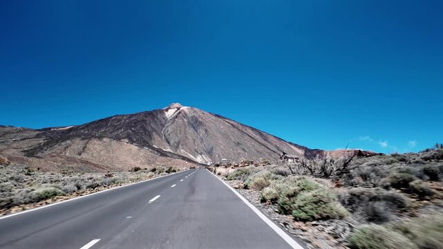 Panoramic view from a moving car of the Teide National Park. The road leading to the Teide volcano, Tenerife, Canary Islands, Spain