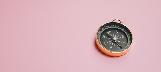 Compass navigation direction travel exploration adventure pink background metal compass pointer instrument guide orientation map tool outdoor journey tourism location travel accessory navigation