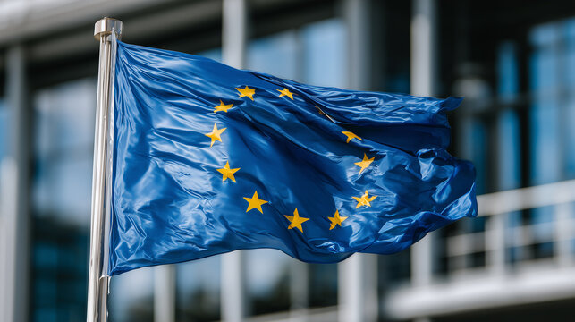 EU flag waving near the entrance of a minimalist modern building, reflections of clouds and sky dancing across the glass panels, highlighting democracy and collective identity