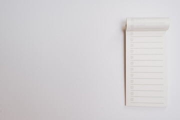 Checklist notepad with empty boxes and lines on white background, minimalistic design for task planning and organization, clean and simple layout for productivity